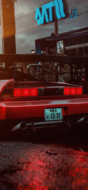 A Red Sports Car Parked On The Street Wallpaper