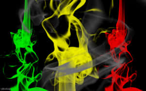 A Red, Yellow And Green Smoke Is Shown On A Black Background Wallpaper