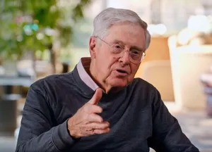 A Reflective Moment Of Charles G. Koch Wallpaper