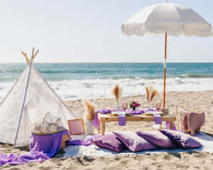 A Relaxing Beach Picnic On A Sunny Day Wallpaper