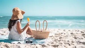 A Relaxing Beach Picnic Setup With Snacks And Pillows Wallpaper