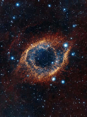 A Ring Shaped Nebula In Space Wallpaper