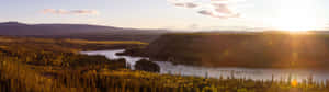 A River And Mountains In The Sun Wallpaper