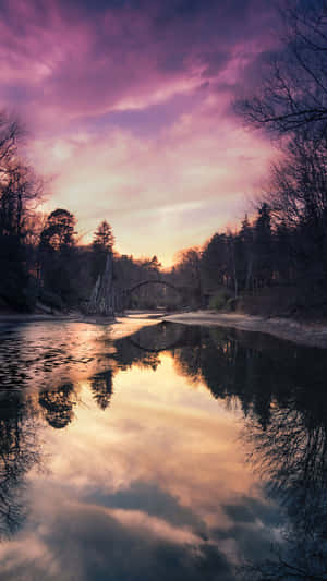 A River With Trees In The Background Wallpaper