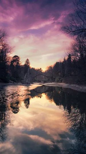 A River With Trees In The Background Wallpaper