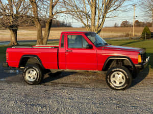 A Rugged Jeep Comanche Exploring The Wilderness Wallpaper