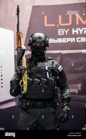 A Russian Soldier In A Uniform Stands In Front Of A Display Of A - Stock Image Wallpaper