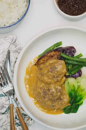 A Savory Bowl Of Kare-kare, A Traditional Filipino Delicacy. Wallpaper