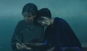 A Scene From The Handmaiden Film Featuring The Lead Actresses In A Serene Garden Wallpaper