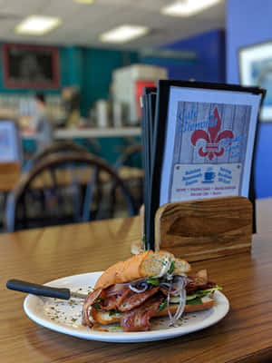 A Scrumptious Plate Of Gourmet Cuisine At Delectable Restaurant Wallpaper