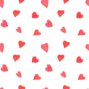 A Seamless Heart Pattern In Vibrant Red Shades Wallpaper
