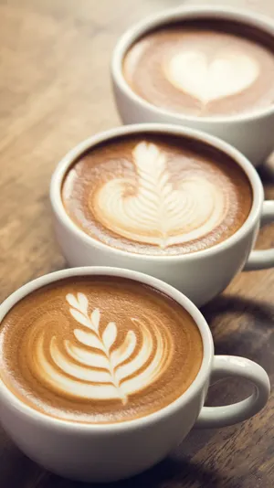 A Secluded Beach Lined With Palm Trees Wallpaper