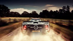 A Sense Of Speed And Movement Captured In A Blur Of Colored Streaks Wallpaper