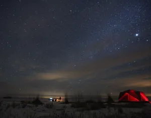 A Serene Beach Camping Experience At Sunset Wallpaper