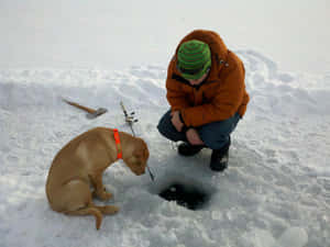 A Serene Day Ice Fishing On A Frozen Lake Wallpaper