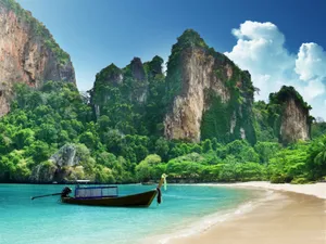 A Serene Day Of Boating On A Beautiful Lake Wallpaper