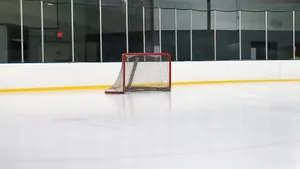 A Serene Ice Rink At Night Wallpaper