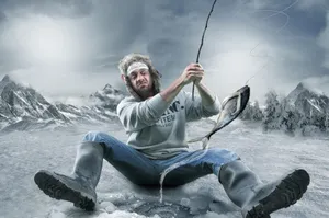 A Serene Landscape Of Ice Fishing On A Frozen Lake Wallpaper