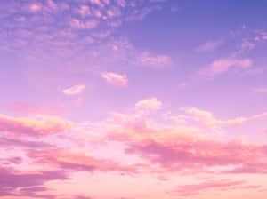 A Serene Pink Sky During Sunset Wallpaper