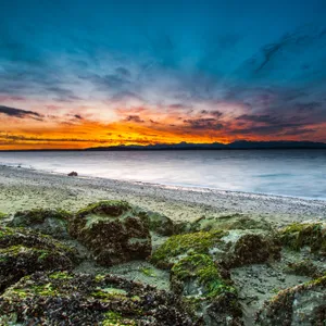 A Serene Sunset At The Beach Wallpaper