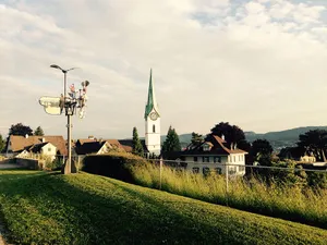 A Serene Sunset Over Zollikon Wallpaper