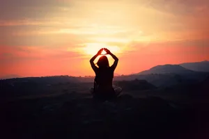 A Serene, Transcendental Landscape Of Sunset Over The Mountains Wallpaper