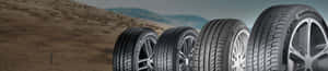 A Set Of Brand New Winter Tires Mounted On Modern Car Wheels Wallpaper