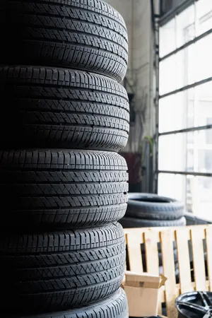 A Set Of Winter Tires On A Snowy Road Wallpaper