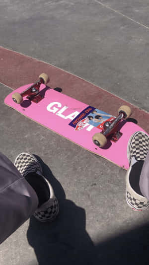A Silhouette Of A Skater Performing A Kickflip In The Street Wallpaper
