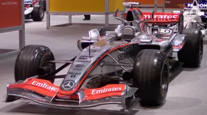 A Silver Racing Car Wallpaper