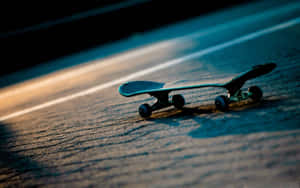 A Skateboard On The Road Wallpaper