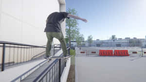 A Skateboarder Is Riding A Railing Wallpaper