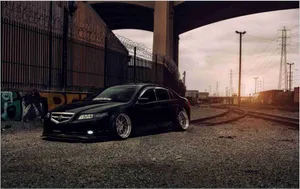 A Sleek Acura Tl On Display Showcasing Its Modern And Stylish Design Wallpaper