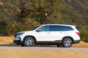 A Sleek And Stylish Honda Pilot On The Road Wallpaper