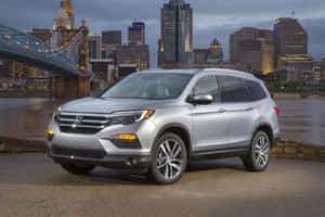 A Sleek And Versatile Honda Pilot On The Road Wallpaper