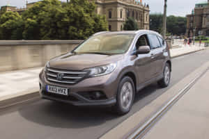 A Sleek Black Honda Cr-v On A Scenic Roadway Wallpaper