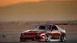 A Sleek Honda Civic Del Sol On The Open Road Wallpaper