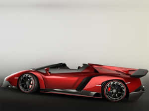 A Sleek Lamborghini Veneno Showcasing Its Powerful Design Against An Urban Backdrop Wallpaper