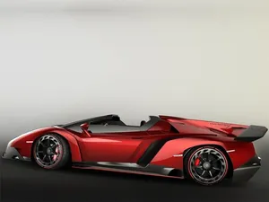 A Sleek Lamborghini Veneno Showcasing Its Powerful Design Against An Urban Backdrop Wallpaper