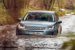 A Sleek Land Rover Discovery On A Scenic Mountain Backdrop Wallpaper