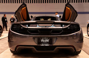 A Sleek Mclaren Mp4-12c In Its Entirety Wallpaper