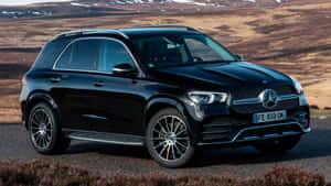 A Sleek Mercedes-benz Gle-class Suv In Motion On An Open Road Wallpaper