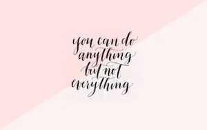 A Sleek, Modern Laptop With Motivational Quote As Its Wallpaper In A Cozy Workspace. Wallpaper