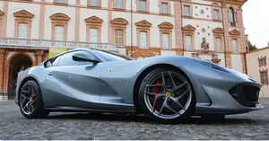 A Sleek Red Ferrari 812 Superfast In Action Wallpaper