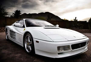 A Sleek, Red Ferrari Testarossa In Motion On An Open Road Wallpaper