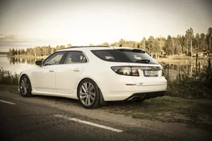 A Sleek Saab 9-4x In A Luxurious Outdoor Setting Wallpaper