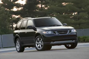A Sleek Saab 9-4x In A Serene Outdoor Setting Wallpaper