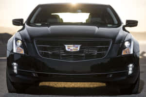 A Sleek Silver Cadillac Ats Parked In An Urban Setting Wallpaper