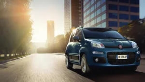 A Sleek, Silver Fiat Panda Parked On A Picturesque Road Wallpaper