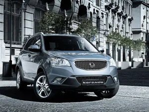 A Sleek Ssangyong Suv On The Road Wallpaper